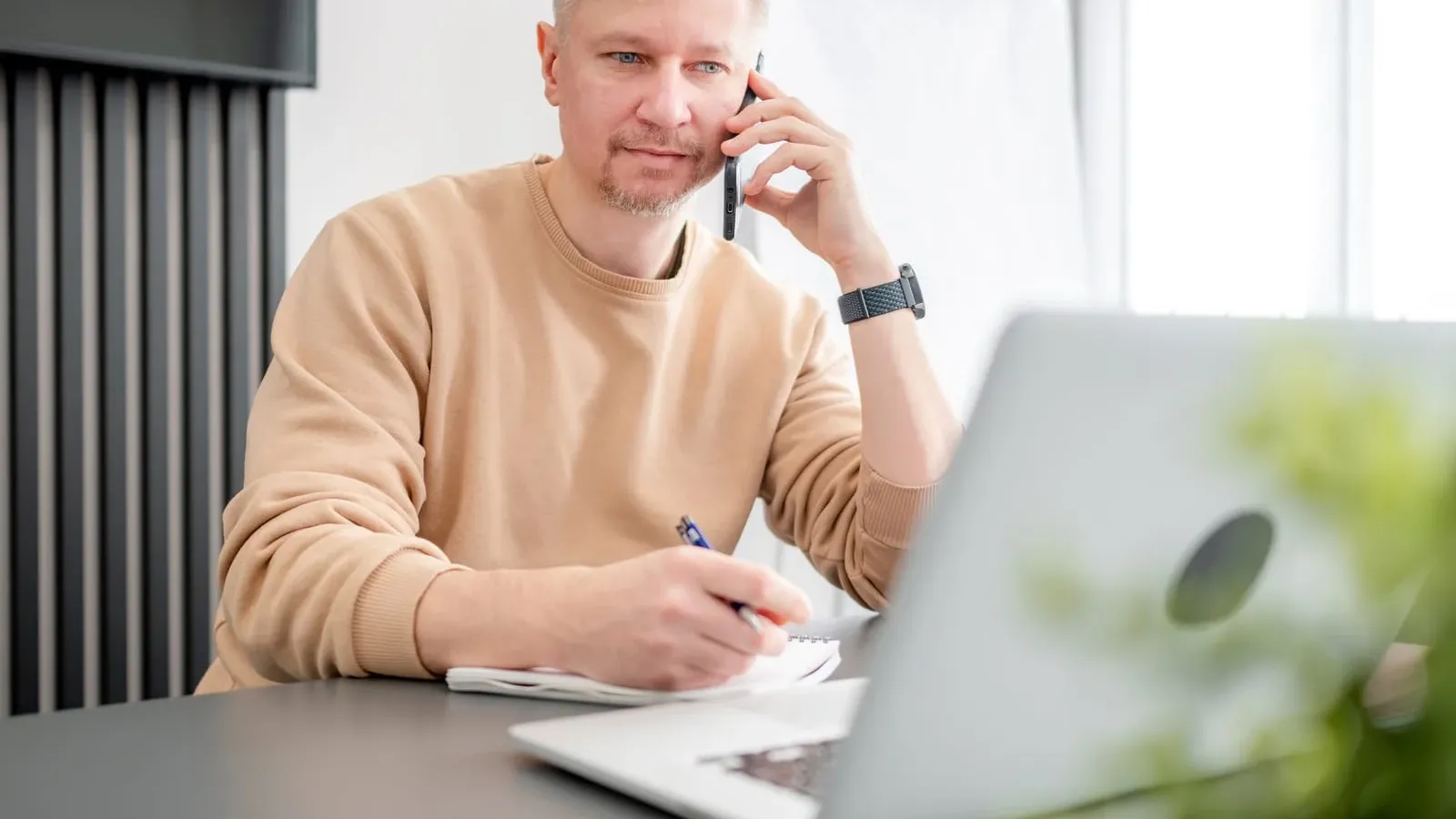 Man Talking On Phone In Office