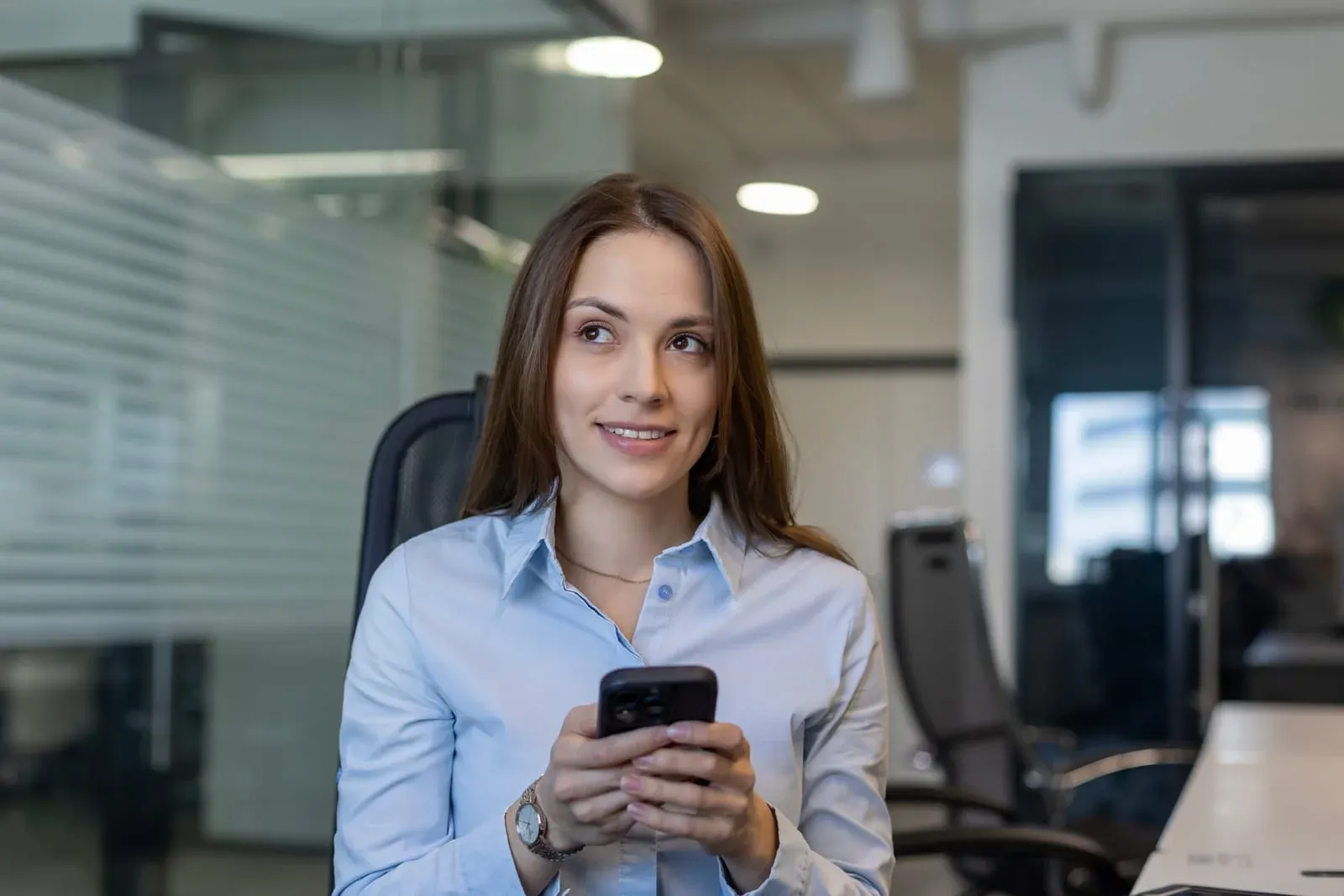 woman updating phone contacts